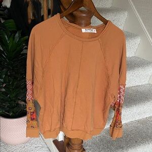 Three Bird Nest Terracotta Sweatshirt with Patterned Sleeves